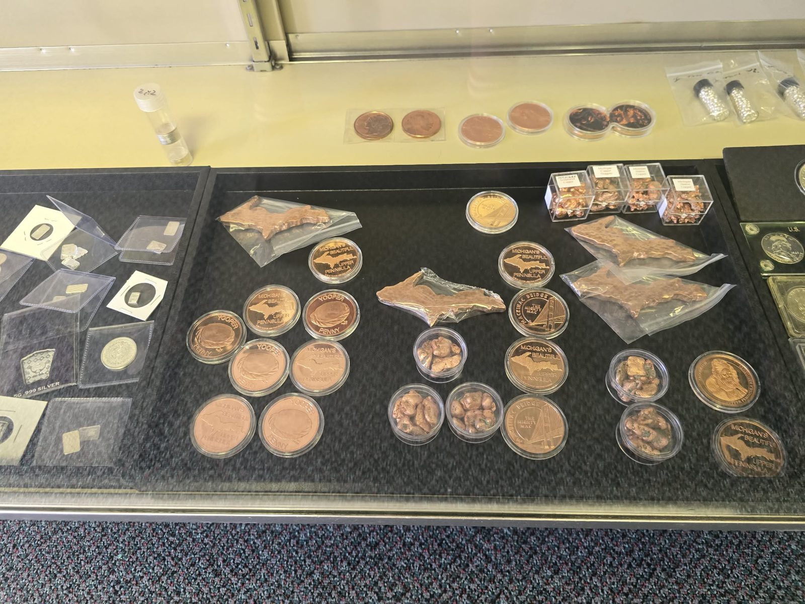 Yooper Penny rounds, Michigan Upper Peninsula copper rounds, native copper nuggets and copper cut in the shape of the U.P.